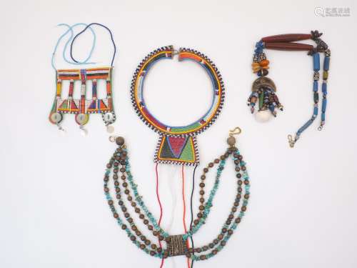 A collection of African and eastern jewellery, to include be...