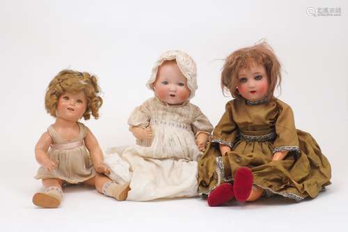 A group of 20th Century dolls, to include a German doll with...