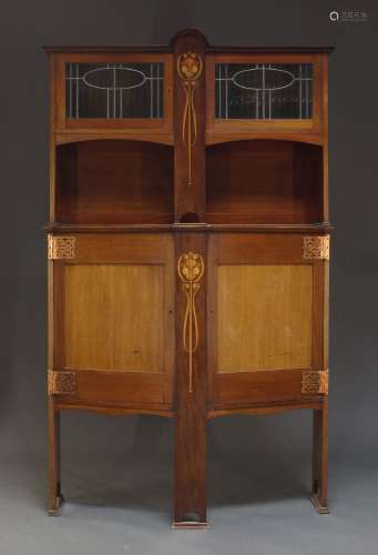 An Arts & Crafts mahogany and inlaid cabinet, the top with t...