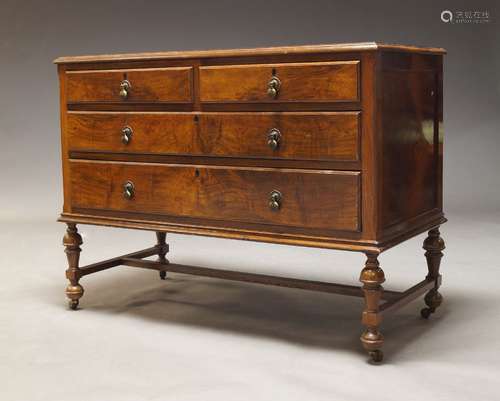 A walnut chest of drawers, early 20th Century, with two shor...