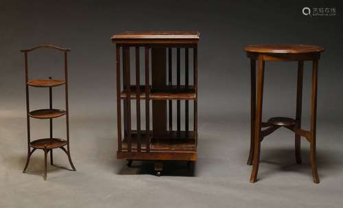 An Edwardian style walnut and inlaid revolving bookcase, sec...