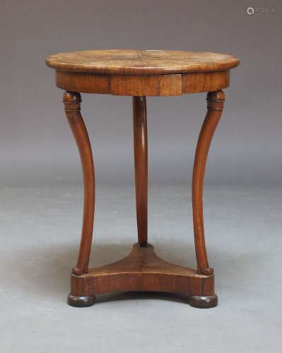 A Louis Philippe mahogany gueridon, the circular radial vene...