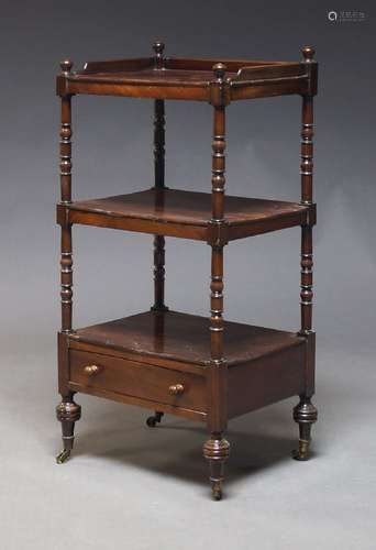 A Victorian mahogany three tier whatnot, with three quarter ...