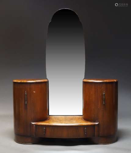 An Art Deco walnut dressing table with shaped mirror plate o...