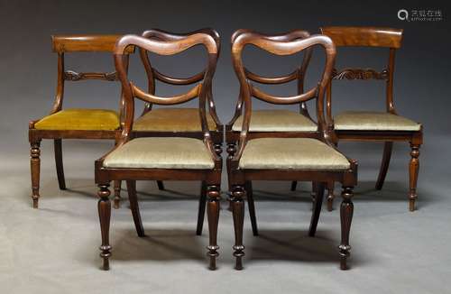 A set of four William IV mahogany balloon back dining chairs...