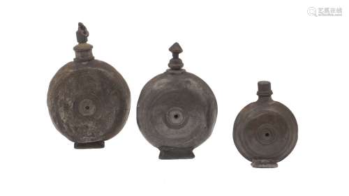 Three pewter flasks, Greek, one dated 1858 another dated 186...