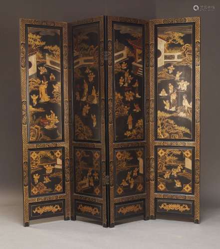 A modern Chinese black lacquered and parcel gilt screen, lat...