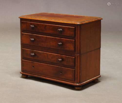 A Victorian mahogany miniature chest, with four long graduat...