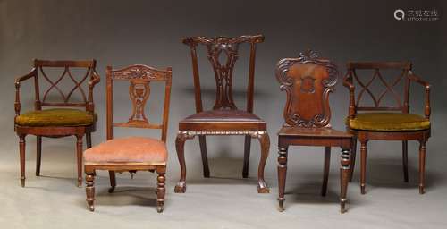 A Victorian mahogany hall chair, the backrest with carved sc...