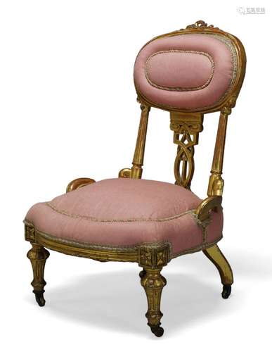 A Victorian gilt wood nursing chair, the oval backrest centr...