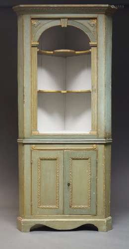 A green painted and parcel gilt corner cupboard, 20th Centur...