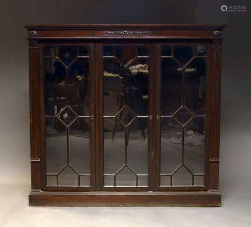 A stained wood bookcase, in the Georgian taste, late 20th Ce...