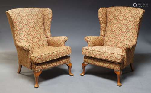 A pair of George III style wingback armchairs by Parker Knol...