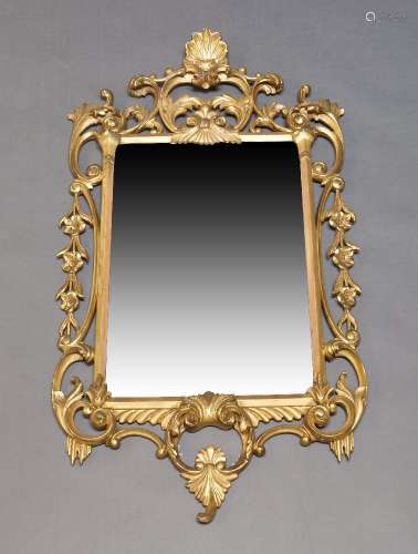 A Louis XV style giltwood wall mirror, 20th Century, with re...