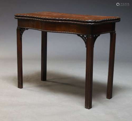 A George III style mahogany serpentine card table, late 19th...