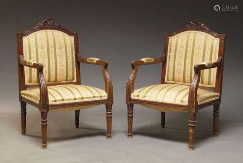 A pair of Louis XVI style stained beech fauteuils, 20th Cent...