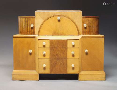 A pair of Art Deco walnut and oak cabinets, the stepped top ...