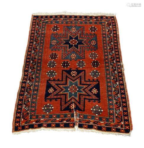 A Shirvan rug, early 20th century, with two star medallions ...