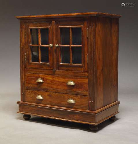 A hardwood and glazed cabinet, late 20th Century, with two g...