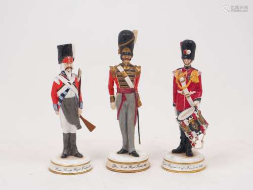 Three Michael Sutty limited edition porcelain figures of fus...