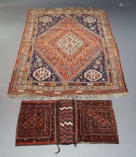 A Qashqai rug, with ivory lozenge in rust coloured field wit...