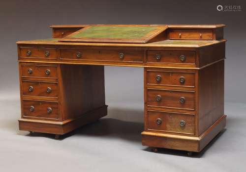 An Edwardian mahogany pedestal desk, the top inset with gree...