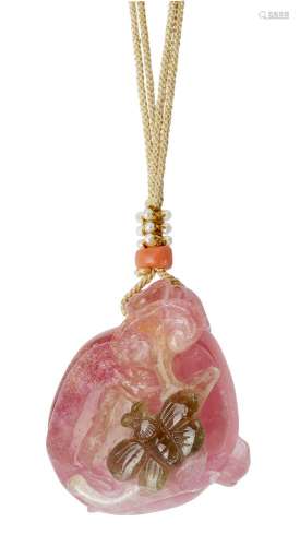 A Chinese pink quartz pendant, early 20th century, carved as...