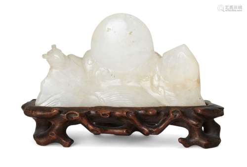 A Chinese quartz brush rest, 20th century, carved as a full ...