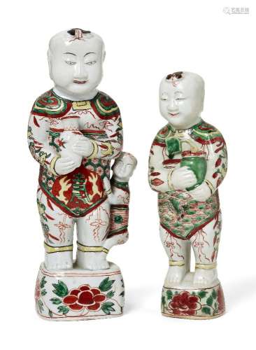 Two Chinese porcelain wucai standing figures of smiling boys...