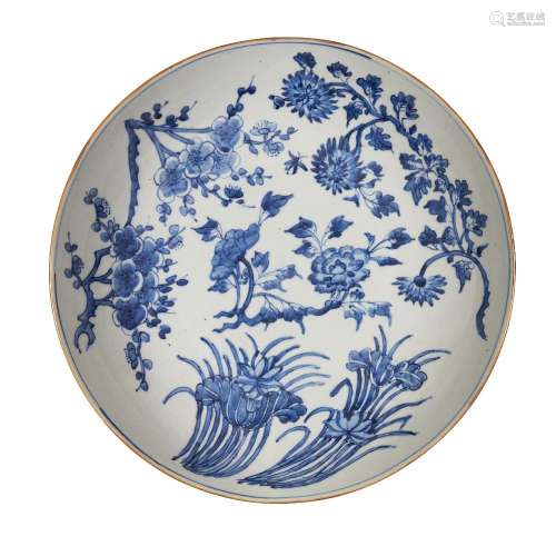 A large Chinese porcelain dish, 19th century, painted in und...