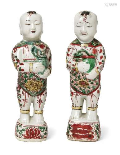A pair of Chinese porcelain wucai standing figures of smilin...