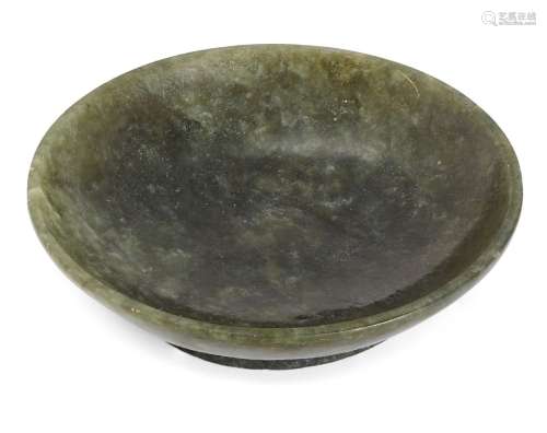 A Chinese spinach-green jade saucer dish, 19th century, with...