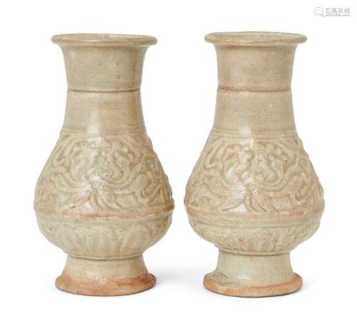 A pair of Song style Qingbai pottery vases, moulded with a b...