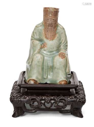 A Chinese Longquan celadon and biscuit figure, Ming dynasty,...