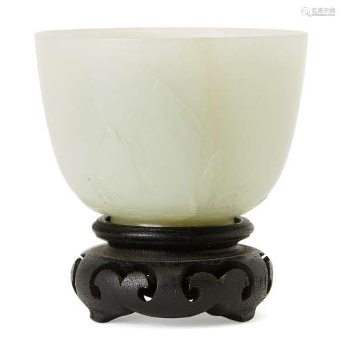 A Chinese celadon jade cup, late Qing dynasty, finely carved...