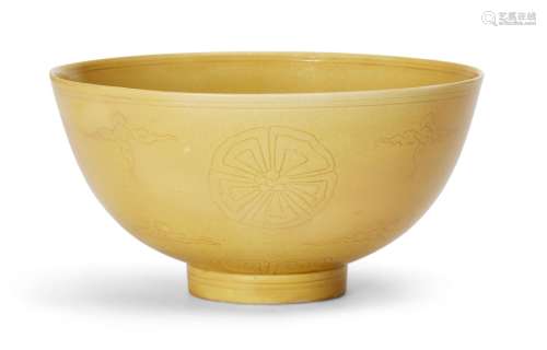 A Chinese porcelain incised yellow-glazed bowl, Kangxi mark ...