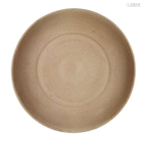 A Chinese celadon glazed moulded dish, Yuan/Ming dynasty, co...