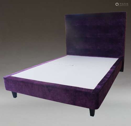 A contemporary purple velvet upholstered double bed, of rece...