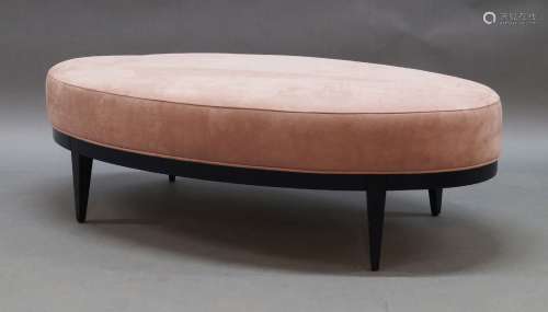 A large contemporary oval stool, of recent manufacture, with...
