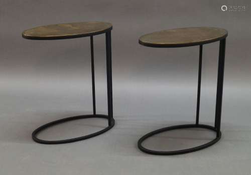 A pair of contemporary oval side tables, of recent manufactu...