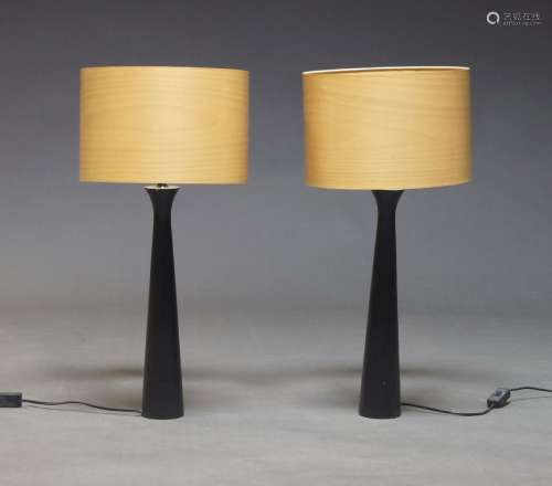A pair of contemporary ebonised lamps, of recent manufacture...