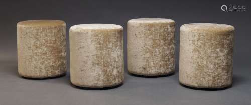 A set of four modern pouffes, of recent manufacture, of cyli...