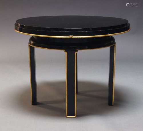 A modern black lacquered and parcel gilt centre table in the...