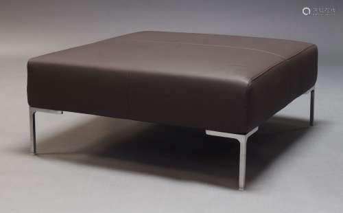 B & B Italia, a brown leather upholstered foot stool, of rec...