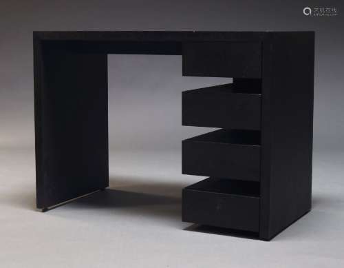 A contemporary ebonised desk, of recent manufacture, the rec...