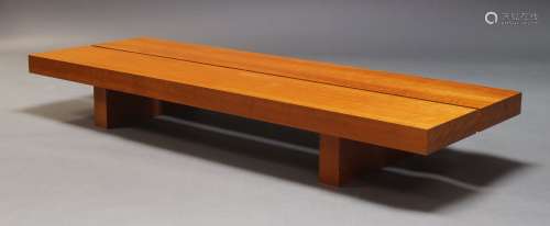 A contemporary cherry wood veneered low coffee table, of rec...