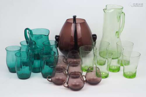 A group of modern glass hosting sets, comprising: a purple g...