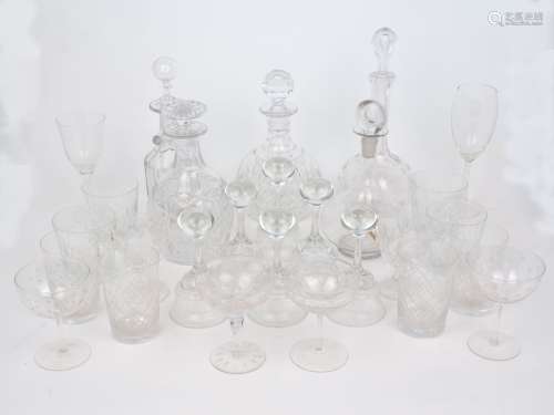 A mixed group of clear glass drink ware comprising: a decant...