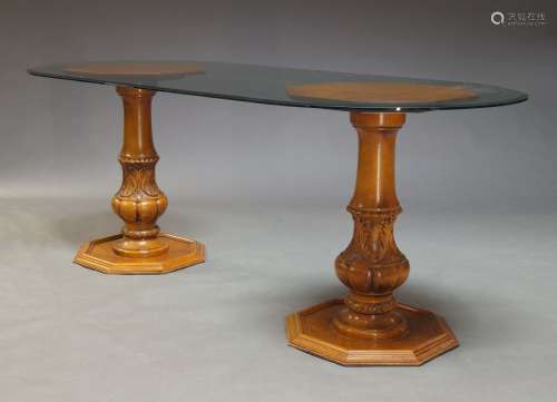 A glazed pedestal dining table, late 20th Century, the round...