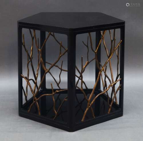 A contemporary black lacquered side table, of recent manufac...
